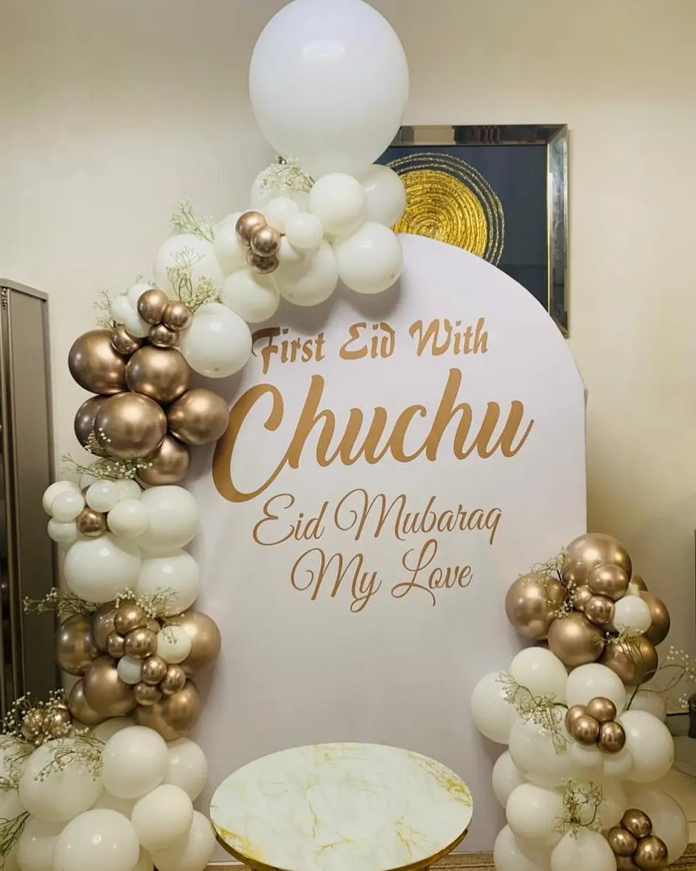 Cream and gold balloon installation for a child's Eid celebration